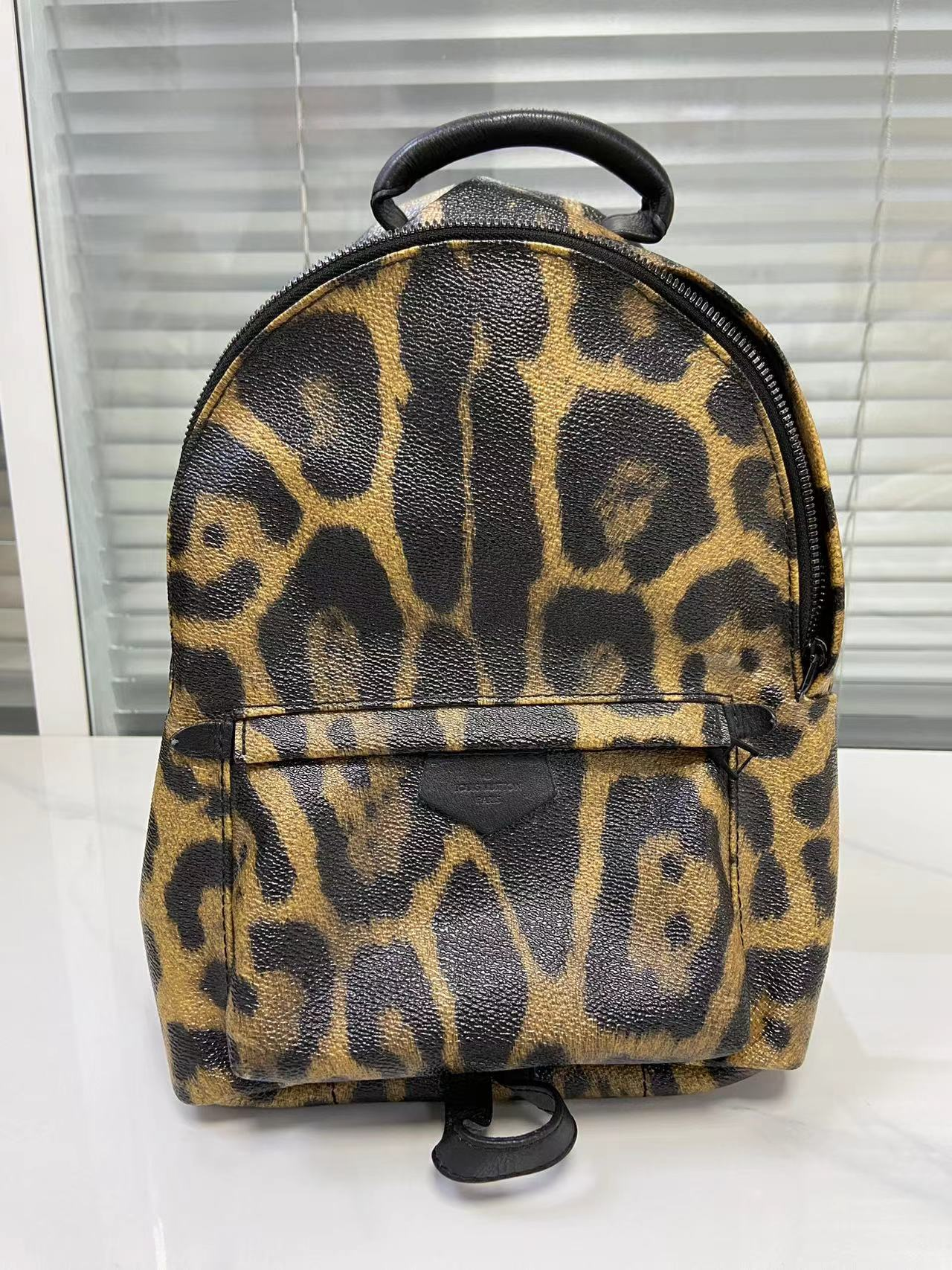 LOUIS VUITTON leopard print backpack